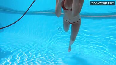 Very juicy hot teen in red swimsuit orgasming underwater
