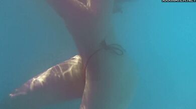 Perfect body brunette enjoys naked swimming