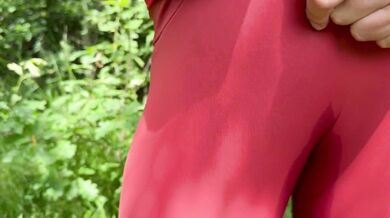 A beauty in leggings pees in nature