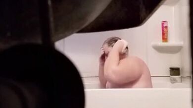 Fat Grandma Christine Krug washing her body.