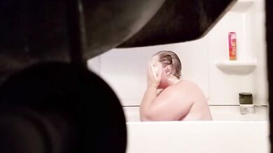 Fat Grandma Christine Krug washing her body.