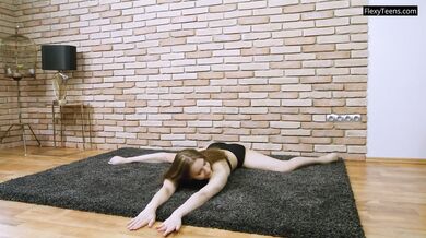 Beautiful sporty ballerina babe stretching legs