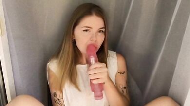 cutie sucks huge pink dildo