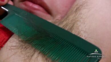 Sexy and hot Naudia spreads her wet pussy and combs out her hair