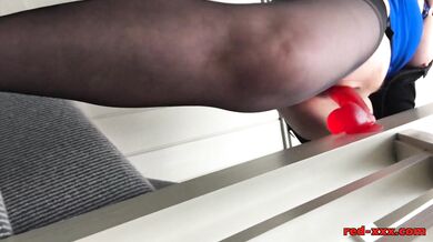 Busty mature Red XXX fucks her dildo on the stairs