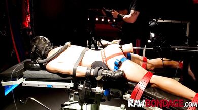 RAWBONDAGE - Chained jock lying face down being fisted in his ass