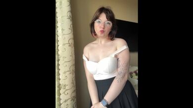 Pretty blonde in a skirt takes off her bra