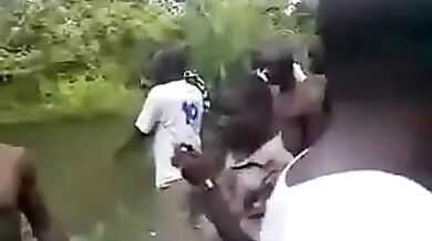 African girl lost a bet as a big group watches