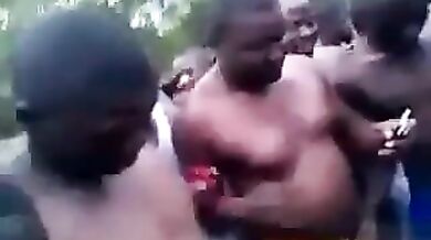 African girl lost a bet as a big group watches