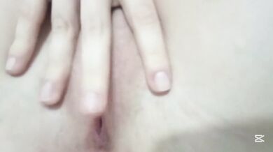 Petite wet girl playing with her little hands