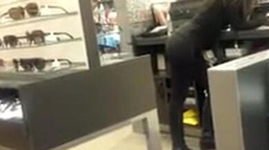 Brunette Latina getting filmed while working in leggings