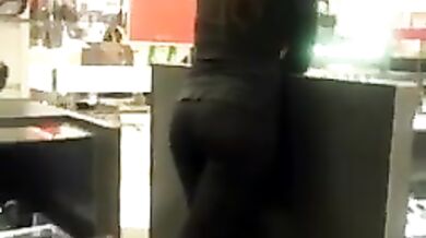 Brunette Latina getting filmed while working in leggings