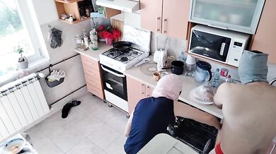 Amateur couple having fun in the kitchen.