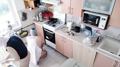 Amateur couple having fun in the kitchen.