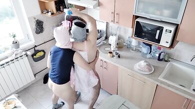 Amateur couple having fun in the kitchen.