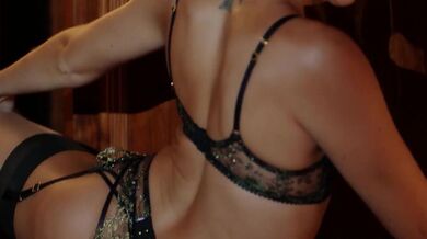 Beautiful lesbians in black lingerie playing with toys