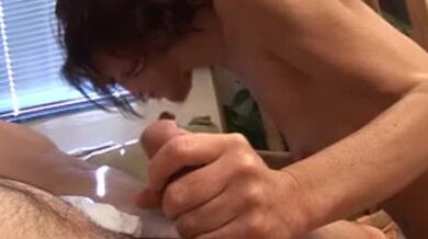 Nasty granny masturbates before two men screw her on the sofa