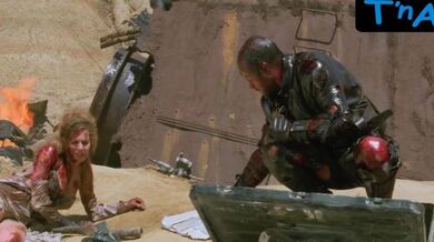 Frederique Feder Breasts Scene in Mutant Action