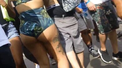 big booty brunette green cheeky shorts