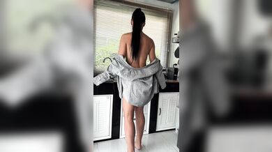 She’s in my shirt, in my kitchen — making my morning HARD before the coffee