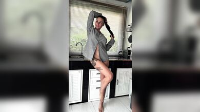 She’s in my shirt, in my kitchen — making my morning HARD before the coffee