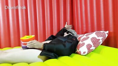 Down Jacket Wearing Fetish Guy Pleasures Himself With Inflatable Water Wing on Bed of Air Mattresses