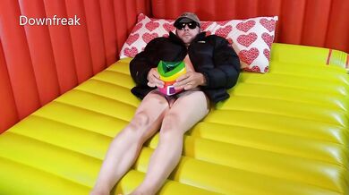 **NO MUSIC** Down Jacket Fetish Guy Fucks Water Wing on Bed of Inflatable Mattress.