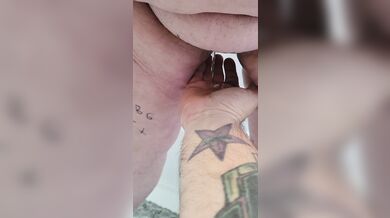 Submissive pisses on owners hand.