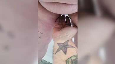 Submissive pisses on owners hand.