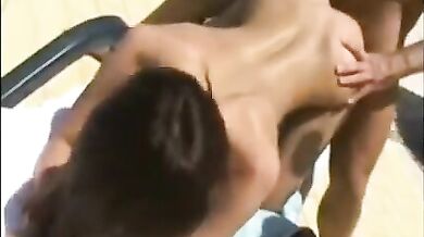 Beautiful brunette fucked by the pool