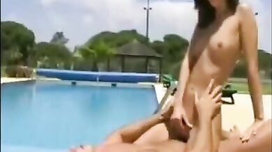 Beautiful brunette fucked by the pool