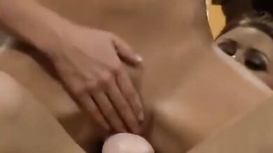 Karlie Montana and Adrienne Manning with a strap on their couch