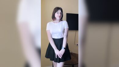 Cute brunette shows her panties under her skirt