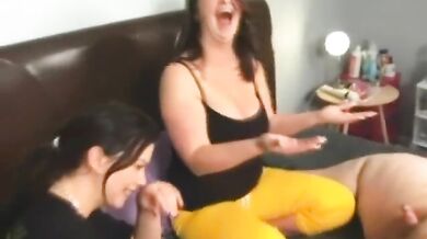Two girls stroking a tiny dick