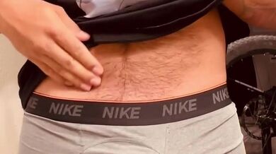 Guy plays with his cock after working out