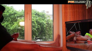 Masturbating by the window while watching porn with hot anal