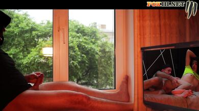 Masturbating by the window while watching porn with hot anal