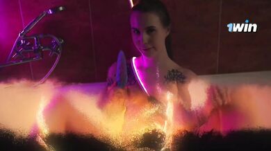 Brunette Neon Bliss: Tattooed Temptation in the Bathtub
