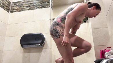 Redhead cleaning her body in truck stop shower — perfect view. Full video in the link on my profile