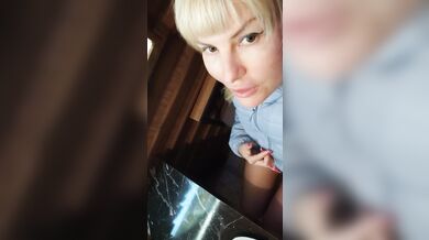 Risky beauty shows sweet pussy in café