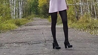 Walking in the park without panties in a mini dress and showing pussy