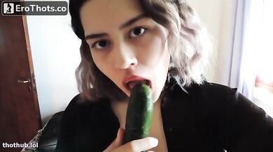 Micaela sucking cucumber
