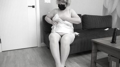 A mature BBW milf with big saggy tits and a hairy pussy gets dressed.