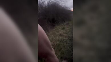 Crazy long walk in fishnets and nude onto a lit street