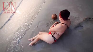 Nice lady at lonely nudist beach. Red swimsuit. Red bikini. Coconut