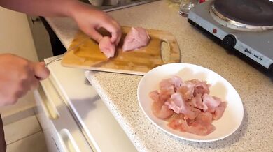 Cali is cooking topless in the kitchen