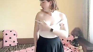Sexy brunette squeezes her big tits.