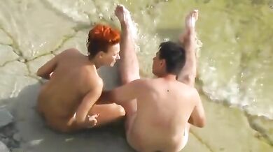 Beach couple sex play
