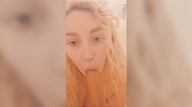 Kitten gives dildo head in the shower hot and steamy