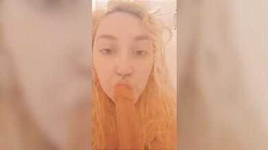 Kitten gives dildo head in the shower hot and steamy